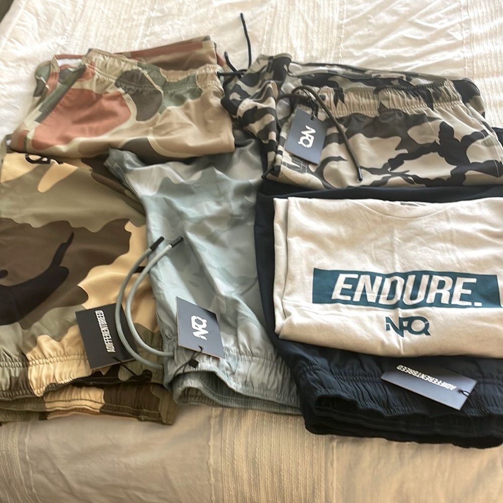 Set of new unused NFQ workout shirt(1) and shorts(4). Size xl never been used